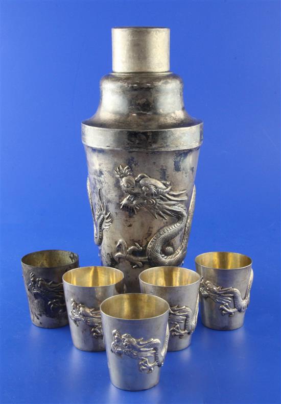 A late 19th/early 20th century Chinese Export silver cocktail shaker and 6 silver tots by Wang Hing, Hong Kong,